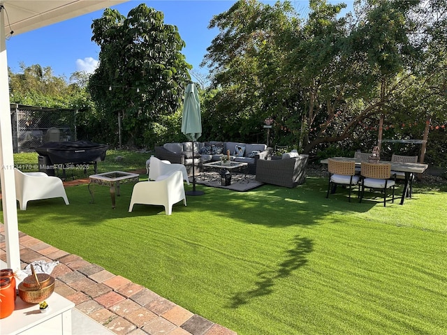 view of yard with outdoor lounge area and a patio area