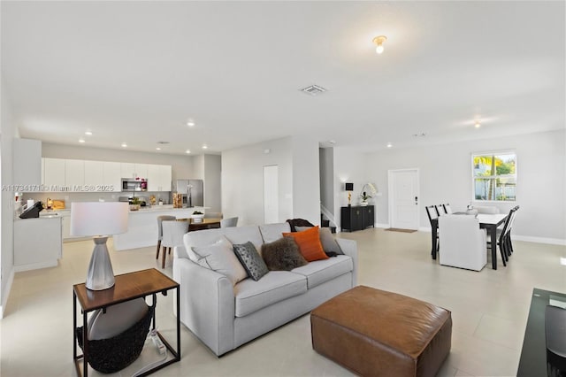 14823 SW 163rd Ter, Miami, FL 33187 - living area with recessed lighting, stairs, and baseboards