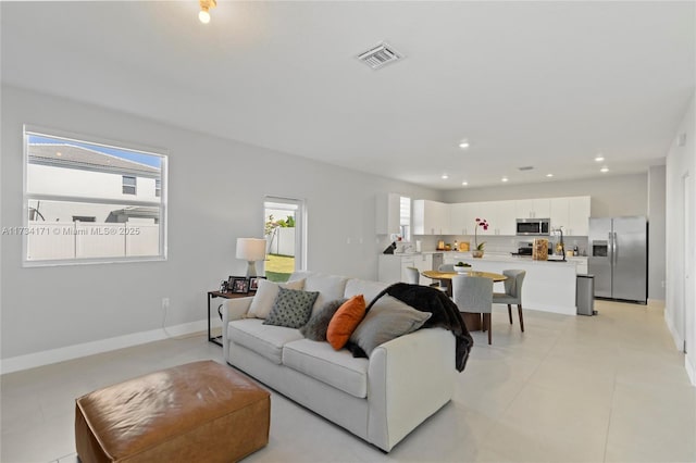 living room featuring a wealth of natural light