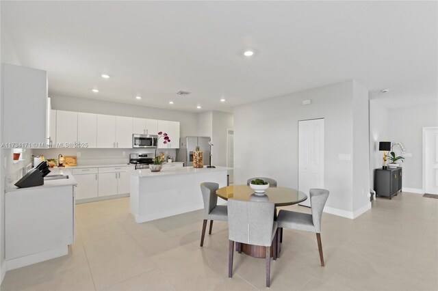 14823 SW 163rd Ter, Miami, FL 33187 - dining room with recessed lighting, light tile patterned floors, and baseboards
