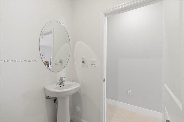 14823 SW 163rd Ter, Miami, FL 33187 - bathroom featuring tile patterned flooring, baseboards, and a sink