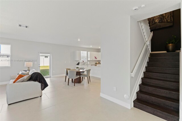 14823 SW 163rd Ter, Miami, FL 33187 - living room with stairs, baseboards, and recessed lighting