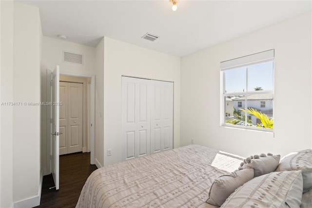 bedroom featuring a closet and dark hardwood / wood-style floors