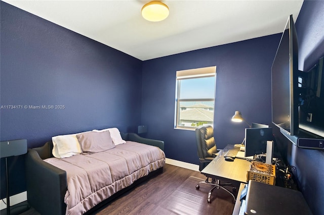 bedroom featuring dark wood-type flooring