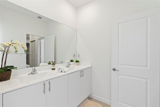 14823 SW 163rd Ter, Miami, FL 33187 - full bathroom with double vanity, baseboards, and tile patterned flooring