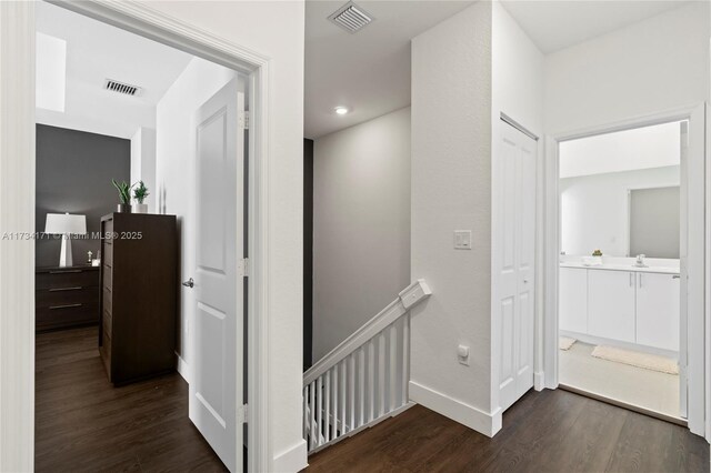 14823 SW 163rd Ter, Miami, FL 33187 - hallway with an upstairs landing, dark wood-style flooring, and baseboards