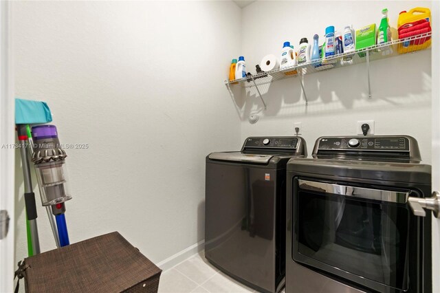 14823 SW 163rd Ter, Miami, FL 33187 - laundry area with washing machine and clothes dryer, light tile patterned flooring, and baseboards
