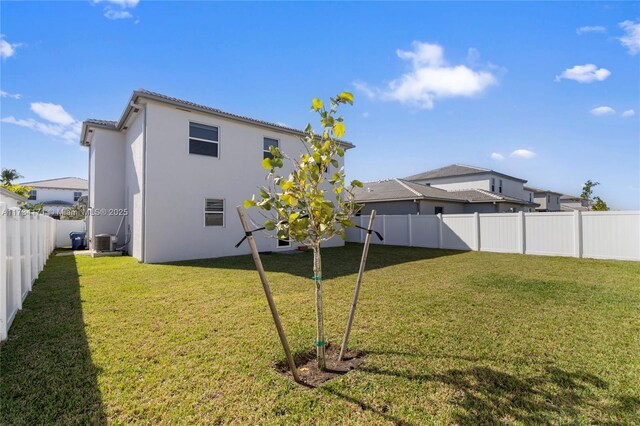 14823 SW 163rd Ter, Miami, FL 33187 - back of property featuring central AC unit, stucco siding, and a tile roof