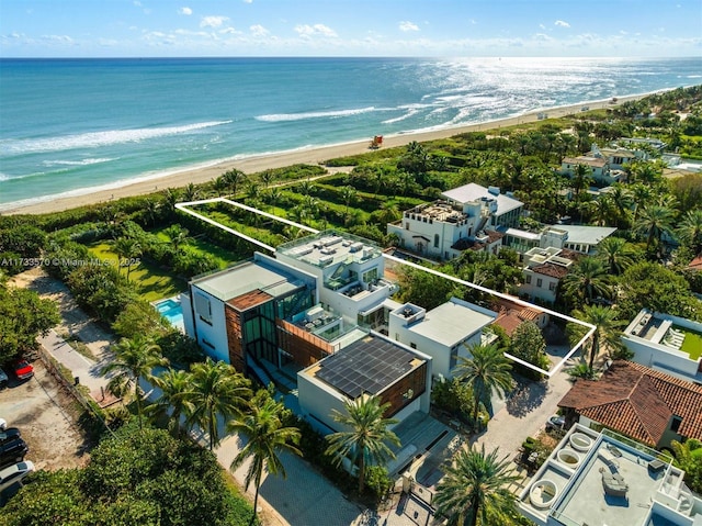 bird's eye view with a water view and a view of the beach