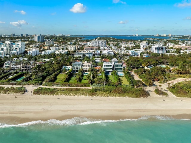 bird's eye view with a view of the beach and a water view