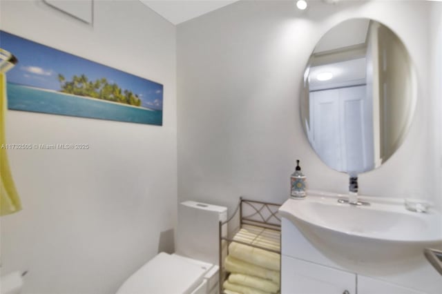 bathroom with vanity and toilet