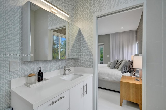 bathroom with tile patterned flooring and vanity