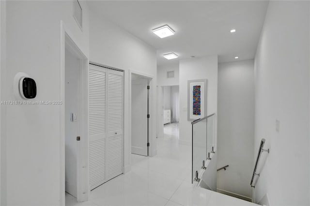 hallway featuring light tile patterned floors