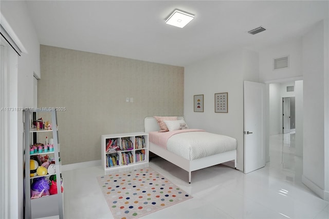 bedroom featuring light tile patterned flooring