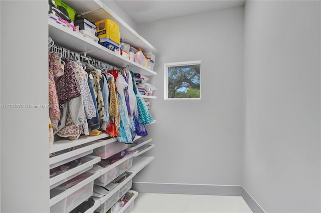 spacious closet with tile patterned flooring