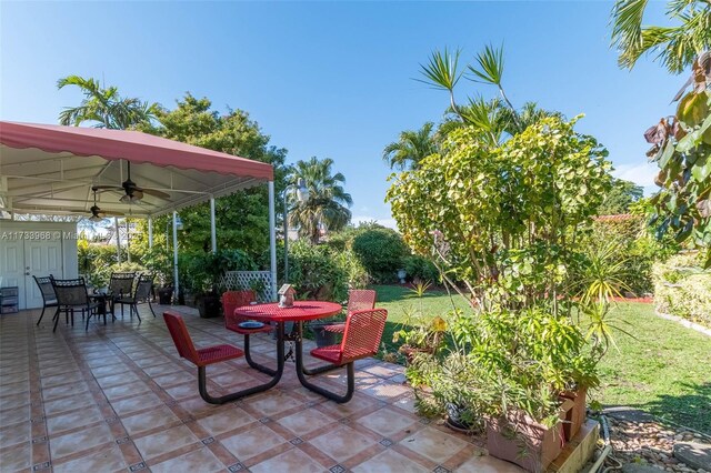view of patio / terrace with outdoor dining space and ceiling fan