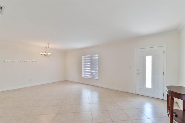 foyer featuring baseboards, an inviting chandelier, ornamental molding, and a wealth of natural light