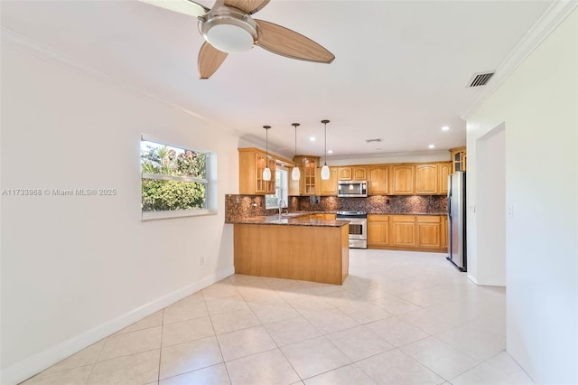 kitchen with stainless steel appliances, a peninsula, visible vents, ornamental molding, and glass insert cabinets