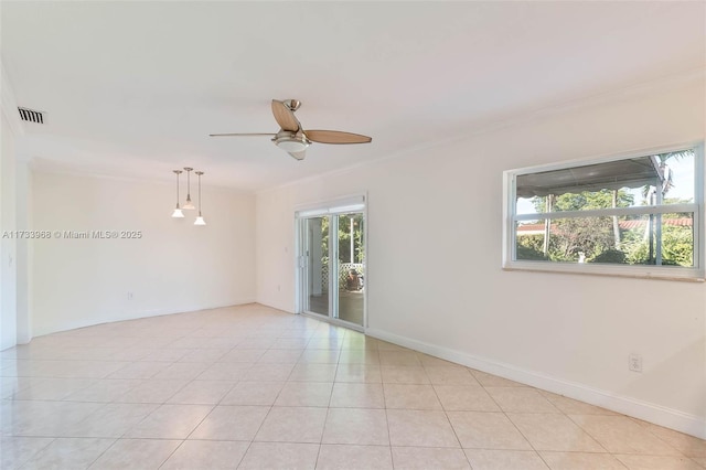 spare room with light tile patterned floors, ornamental molding, and ceiling fan