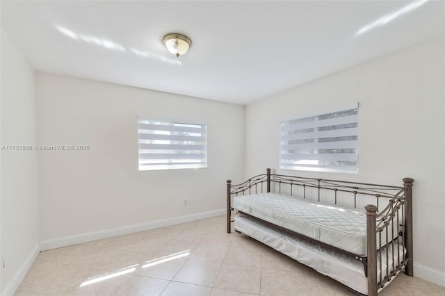 tiled bedroom with baseboards