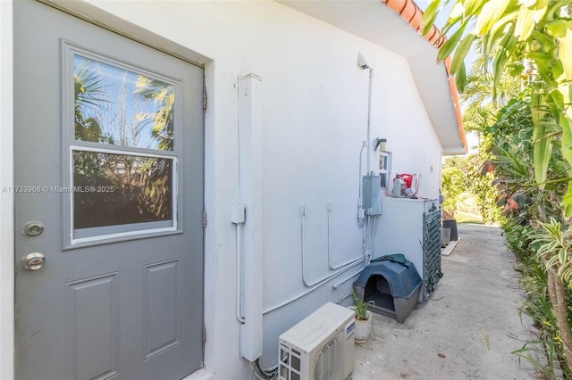 doorway to property with stucco siding