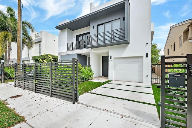 contemporary house with a balcony and a garage