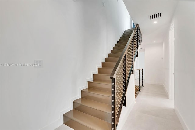 stairway featuring recessed lighting, visible vents, and baseboards