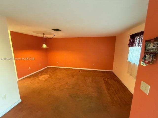 unfurnished room featuring carpet flooring