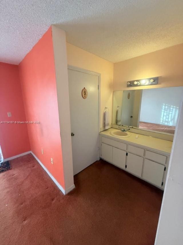 bathroom featuring vanity and a textured ceiling