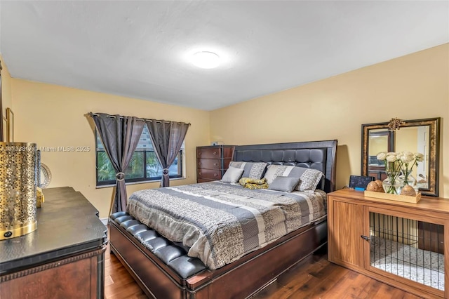 bedroom featuring dark hardwood / wood-style flooring