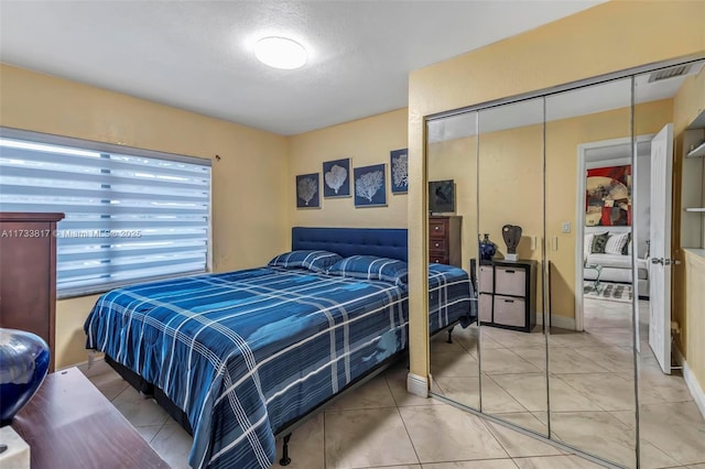 bedroom featuring a closet and a textured ceiling