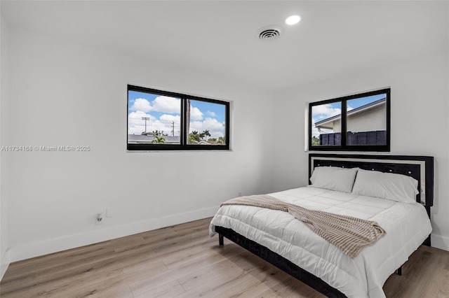 bedroom featuring light hardwood / wood-style flooring