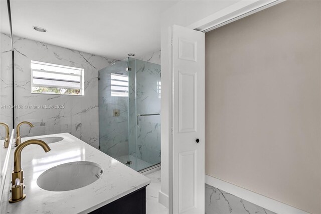 bathroom featuring vanity and an enclosed shower