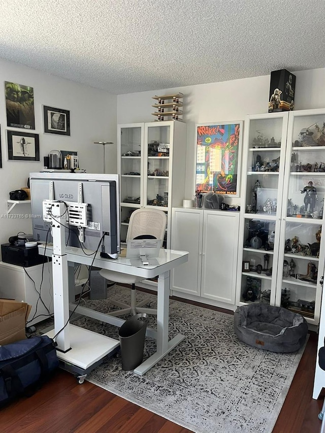 office space with dark hardwood / wood-style flooring and a textured ceiling