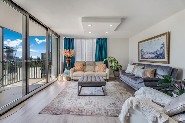 living room featuring hardwood / wood-style floors and floor to ceiling windows