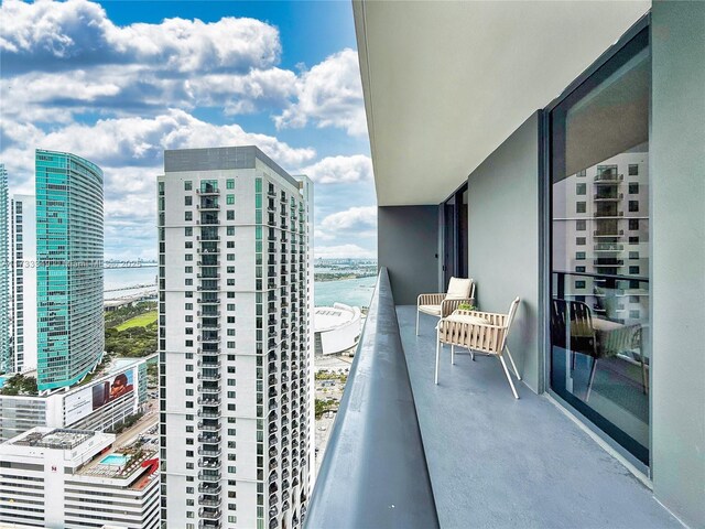 balcony featuring a water view