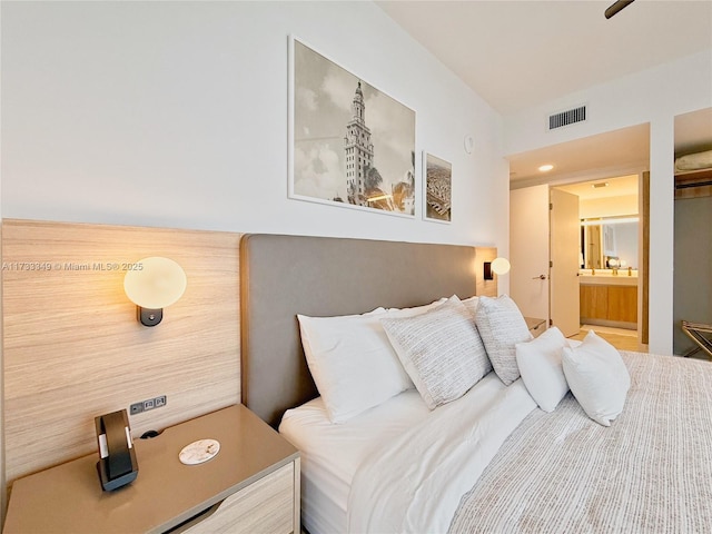 bedroom featuring visible vents and ensuite bathroom