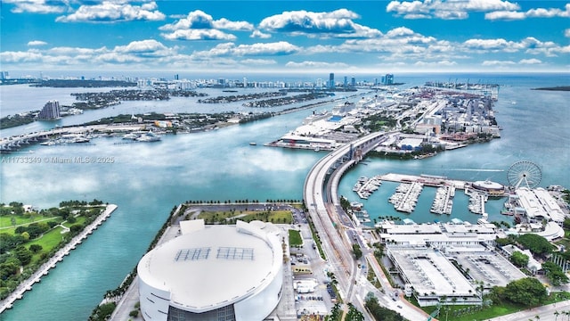 drone / aerial view featuring a water view and a city view