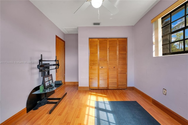 workout room featuring light hardwood / wood-style flooring