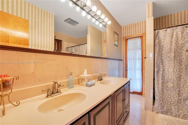 bathroom featuring tile patterned flooring and vanity