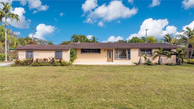 ranch-style home with a patio and a front lawn