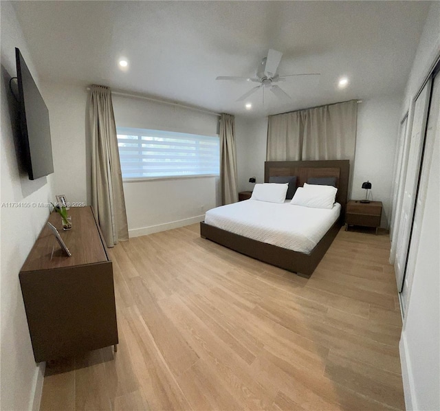 bedroom with ceiling fan and light wood-type flooring