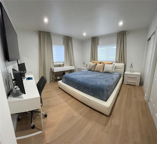 bedroom with light wood-type flooring