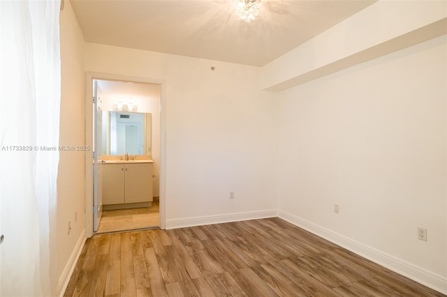 empty room featuring hardwood / wood-style flooring