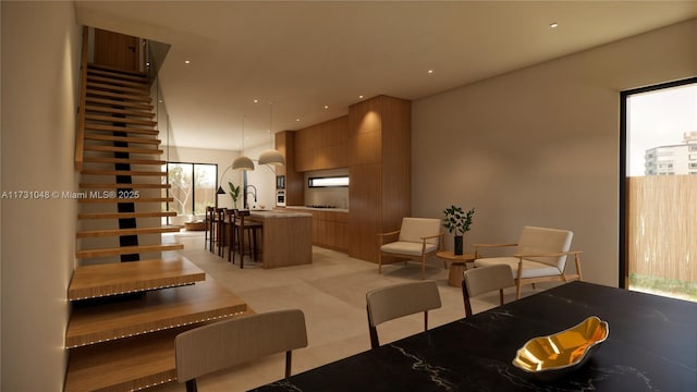 carpeted dining room with plenty of natural light and sink