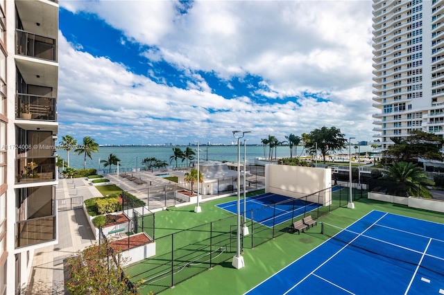 view of sport court featuring a water view