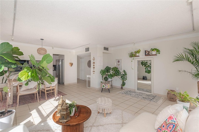 tiled living room featuring crown molding and a textured ceiling