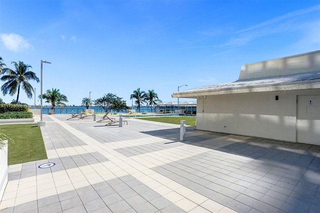 view of patio with a water view