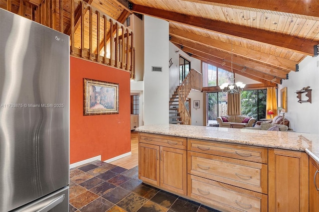 kitchen with decorative light fixtures, high vaulted ceiling, wooden ceiling, stainless steel fridge, and a notable chandelier