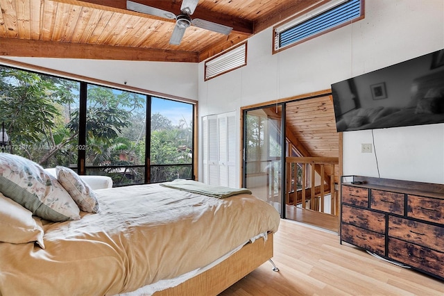 bedroom with light hardwood / wood-style flooring, ceiling fan, vaulted ceiling with beams, access to outside, and wooden ceiling